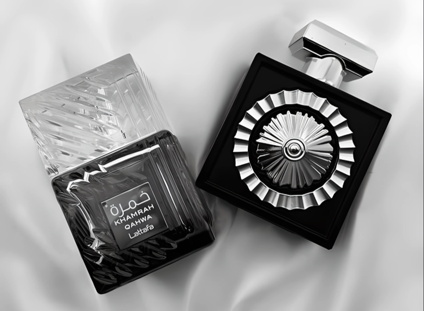 Perfume bottle with decorative cap on a white fabric background